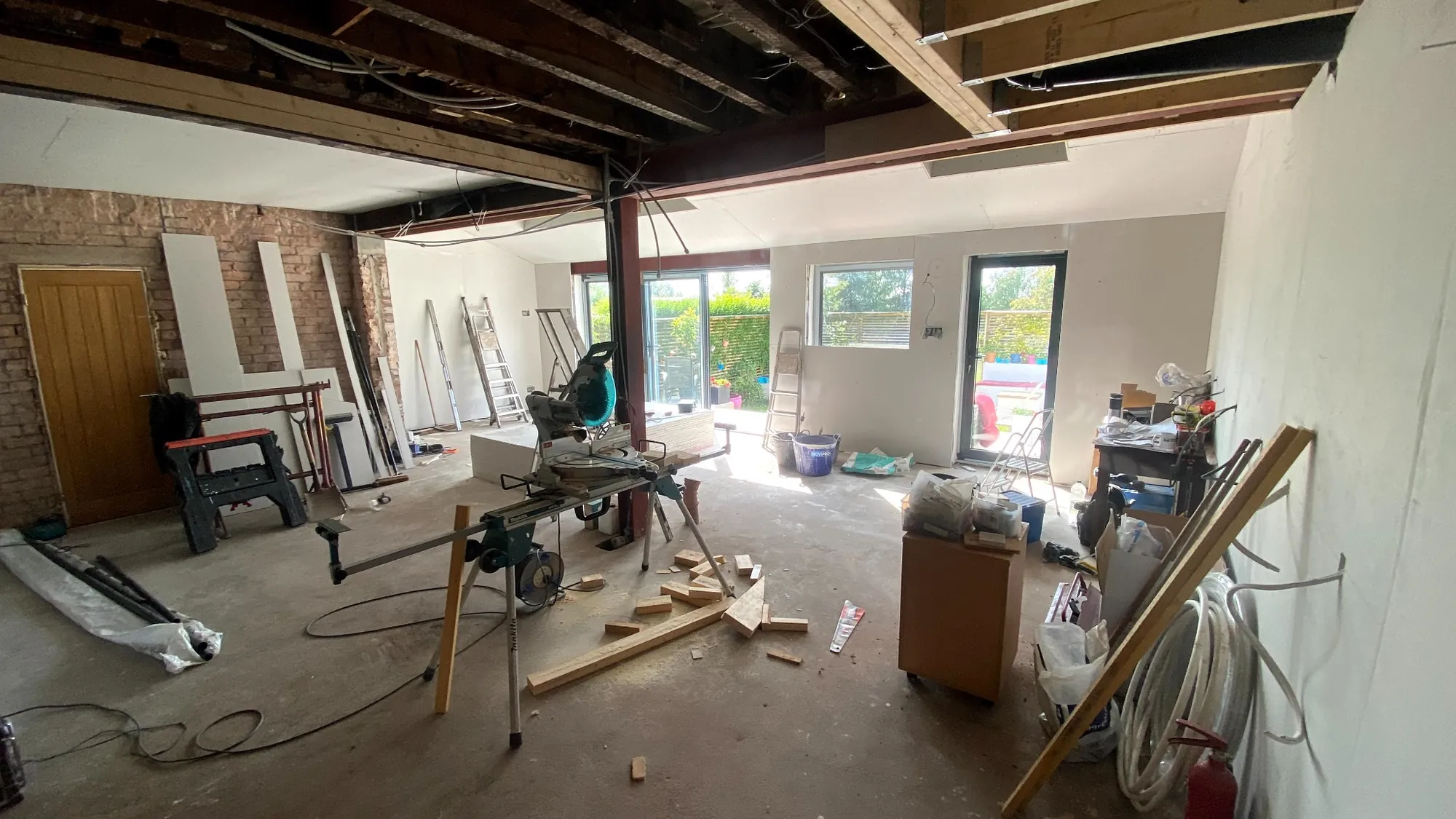 Kitchen renovation in progress with exposed steels and open plan layout in Stockport