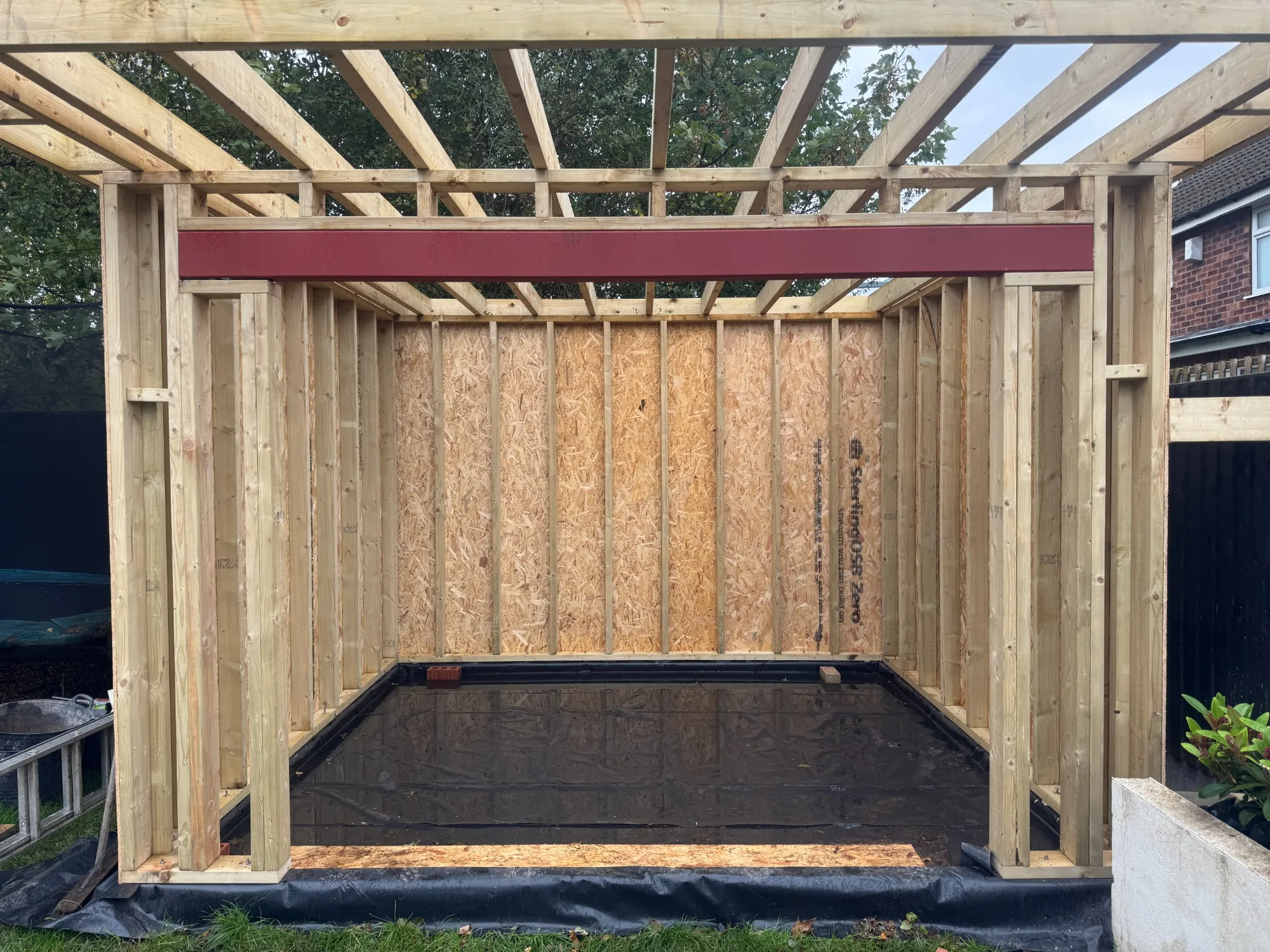 Timber frame garden room under construction in a Stockport back garden